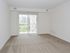 Living room with beige carpet at Gladstone Towers apartments for rent in Lansdowne, PA