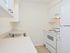 Model kitchen with modern appliances at Rolling Glen Townhomes and Apartments in Boothwyn, PA.