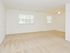 Carpeted living room area at Rolling Glen Townhomes and Apartments in Boothwyn, PA.