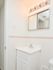 Model bathroom with vanity sink at Rolling Glen Townhomes and Apartments in Boothwyn, PA.