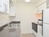 Model kitchen with modern appliances at Rolling Glen Townhomes and Apartments in Boothwyn, PA.