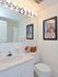 Model bathroom with a vanity sink and toilet at Valley Stream Apartments in Lansdale, PA.