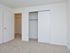 Carpeted bedroom with closet at Willow Ridge Apartments in Marlton, NJ.