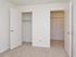 Carpeted bedroom with closet at Willow Ridge Apartments in Marlton, NJ.