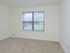 Carpeted bedroom with a large window at Willow Ridge Apartments in Marlton, NJ.