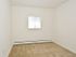 Bedroom with a window at Boothwyn Court apartments for rent in Boothwyn, PA