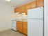 Kitchen with beige tile flooring at Boothwyn Court apartments for rent in Boothwyn, PA