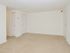 Dining room with beige carpet and closet storage space at Boothwyn Court apartments for rent
