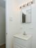 Bathroom with white cabinets at Boothwyn Court apartments for rent in Boothwyn, PA