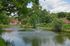 Landscaped grounds and pond around the property of Whiteland West Apartments in Exton, PA.
