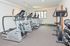 Fitness center with treadmills, ellipticals, stationary bikes and weights at Whiteland West Apartments in Exton, PA.