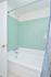 Master Bathroom with tiled tub shower at Naamans Village Apartments in Claymont, DE.