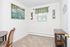 Spacious carpeted bedroom furnished with a desk and chair at Naamans Village Apartments in Claymont, DE.
