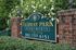 Green welcome sign at Fairway Park apartments for rent in Wilmington, DE