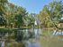 Landscaped grounds with a pond at Norriton East Apartments in East Norriton, PA.