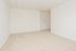 Carpeted model living room at Norriton East Apartments in East Norriton, PA.