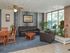 Resident club house with tables and couches at Norriton East Apartments in East Norriton, PA.