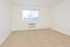 Carpeted main bedroom with large windows and in-wall A/C unit at Norriton East Apartments in East Norriton, PA.