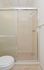 Bathroom with tiled walk-in stall shower at Norriton East Apartments in East Norriton, PA.