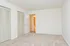 Carpeted bedroom with double closets at The Lafayette at Valley Forge apartments in King of Prussia, PA.