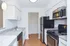 Model kitchen with breakfast bar and stainless-steel appliances at The Lafayette at Valley Forge apartments in King of Prussia, PA.