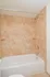 Bathroom with tiled tub shower at The Lafayette at Valley Forge apartments in King of Prussia, PA.