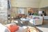 Community center lounge area with a fireplace and couches at The Lafayette at Valley Forge apartments in King of Prussia, PA.