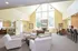 Community center lounge area with a fireplace and couches at The Lafayette at Valley Forge apartments in King of Prussia, PA.