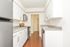 Beautiful, bright kitchen with white cabinets and stainless steel appliances
