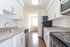 Galley kitchen with stainless steel appliances and updated features in King of Prussia apartment for rent