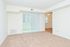 Carpeted living room with sliding glass patio doors at Willow Run Apartments in Willow Grove, PA.