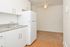 Model kitchen with wood-style floors and modern appliances at Woodview Apartments in Media, PA.