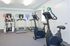 Fitness center with cardio machines at Cedar Tree Village apartments for rent