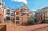 Looking over a brick balcony at Waterloo Place Apartments in Baltimore, MD.
