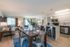 Beautiful, modern open layout with kitchen, dining area, and living space with hardwood floors throughout
