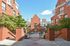 Paved courtyard area between two of the buildings at Waterloo Place Apartments in Baltimore, MD.