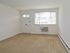 Living room with front door and window at Concord Court apartments for rent in Aston, PA