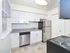 Open kitchen with granite countertops at Fox Run apartments for rent in Warminster, PA