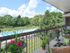 Beautiful balcony view of landscaped grounds and swimming pool from Main Line Berwyn Apartments
