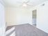 Cheery dining area with ceiling fan and light and carpet flooring