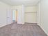 Spacious bedroom with large closet and grey carpeting in Berwyn, PA apartment for rent