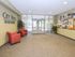 Lobby with red chairs at City View apartments for rent in Lancaster, PA