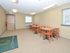 Community room with tables and chairs at City View apartments for rent in Lancaster, PA