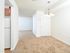 Dining room with hanging chandelier, carpet flooring, and a storage closet