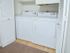 In-unit laundry room with full sized washer and dryer at Waterloo Place Apartments in Baltimore, MD.