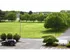 Tree lined parking lot of Winslow House Apartments in Blackwood, NJ.