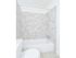 Beautiful upgraded bathroom with stone tile shower and tub