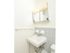 Model bathroom with sink and tiled backsplash at Woodland Plaza Apartments in Wyomissing, PA.