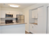 Willow Ridge Village model kitchen with island bar countertop and storage space in Marlton, NJ.
