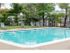 Swimming pool with lifeguard and lounge chairs for residents of Middle River Apartments